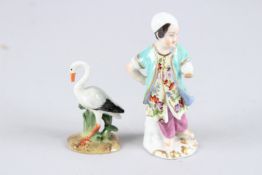 A TINY 19TH CENTURY MEISSEN BIRD, 2.2ins high, and a figure of a young boy, 3.75ins high. Crossed