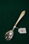 A DANISH SILVER HANDLED SERVING SPOON.