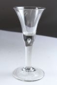 A GEORGIAN WINE GLASS with teardrop stem. 6.5ins high.