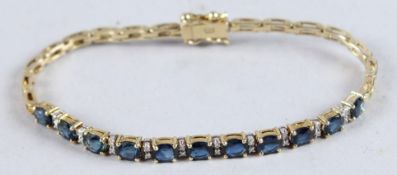 AN 18CT GOLD SAPPHIRE LINE BRACELET.