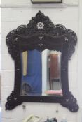 A LARGE 19TH CENTURY ISLAMIC SHAPED MIRROR with pierced decoration and mother-of-pearl. 4ft 6ins
