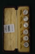A SET OF SIX MOTHER-OF-PEARL DRESS STUDS, cased.