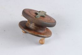 A WOODEN REEL. 4ins diameter.