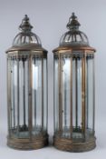A LARGE PAIR OF CIRCULAR COPPER LANTERNS. 24ins high.