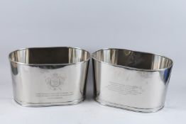 A PAIR OF OVAL BOLLINGER WINE COOLERS. 17ins high x 9.5ins long.