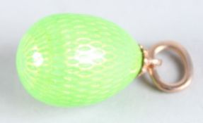 A RUSSIAN GREEN ENAMEL EGG PENDANT.