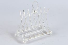 A SILVER PLATED GOLFING TOAST RACK.