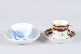 AN EMPIRE BLUE RIMMED CUP AND SAUCER with gold mark, and A BLUE AND WHITE TEA BOWL AND SAUCER.