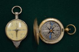 A COMBINATION COMPASS AND MAP MILOMETRE together with another compass.
