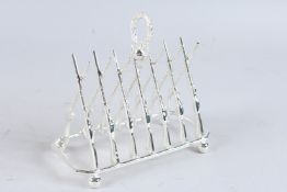 A SILVER PLATED GUN TOAST RACK.