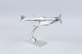 A CHROME SPITFIRE. 11ins high.