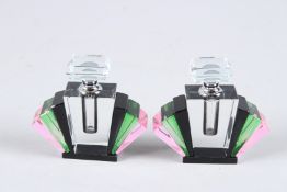 A SMALL PAIR OF ART DECO DESIGN BLACK, GREEN AND PINK FAN SHAPE SCENT BOTTLES. 3.5ins high.