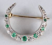 A GOOD GOLD, EMERALD AND DIAMOND CRESCENT BROOCH.