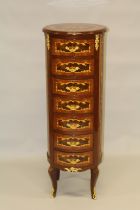 A LOUIS XVITH DESIGN SEVEN DRAWER MARQUETRY TALL CHEST. 4ft 2ins high x 4ft 5ins diameter.