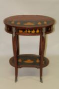 AN OVAL INLAID TWO TIER TABLE on curving legs. 2ft wide x 2ft 6ins high.