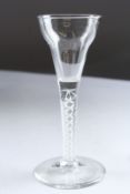 A GEORGIAN WINE GLASS with white air twist stem. 6ins high.
