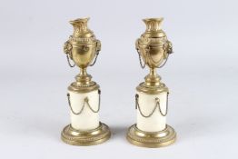 A PAIR OF REGENCY GILT BRONZE AND MAHOGANY CASSOLETTES with reversible sconces. 9ins high.