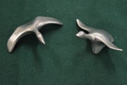 A PAIR OF CAST METAL MODELS OF SWANS.