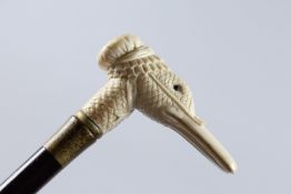A WALKING STICK WITH A CARVED BONE HANDLE, DUCK'S HEAD.