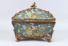 A LARGE PORCELAIN CASKET AND COVER with gilt metal fruiting vines and parrot handle. 15ins long.