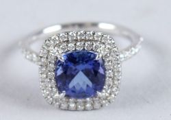 A GOOD TIFFANY RUBY AND DIAMOND CLUSTER RING in a Tiffany box.