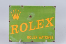 AN ENAMEL ROLEX SIGN. 11.5ins x 14.5ins.