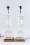 A GOOD PAIR OF GLASS URN SHAPED LAMPS. 23ins high.