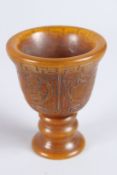 A CHINESE CARVED HORN CUP. 3.5ins high.