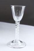 A GEORGIAN WINE GLASS with white circular twist stem. 5.5ins high.