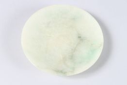 A CHINESE PLAIN CIRCULAR SHALLOW DISH. 4.5ins diameter.