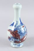 A CHINESE BLUE AND BROWN ONION TOP VASE with buildings. 10ins high.