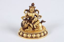 A TIBETAN GOLD PLATED ALLOY STATUE OF YAMANTAKA, a wrathful deity in Tibetan Buddhism.