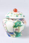 A CHINESE GINGER JAR AND COVER decorated with lots of small boys.