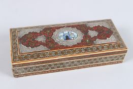 A PERSIAN INLAID RECTANGULAR BOX, the lid with enamel plaque and silver. 8.75ins high x 3.5ins