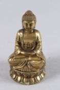 A SMALL GILDED BRONZE BUDDHA. 4.5ins high.