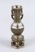 A SMALL CHINESE BROWN GLAZED HEXAGONAL VASE. 7.5ins high.