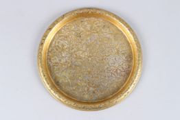 A FINELY ENGRAVED OTTOMAN TURKISH GILDED COPPER TOMBAK TRAY. 8ins diameter.