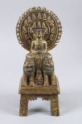 A GOOD BRONZE GOD seated on two lions. 11ins high.