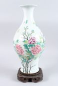 A CHINESE FAMILLE ROSE PEONY VASE AND HARDWOOD STAND.