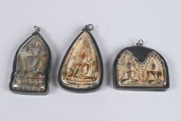 THREE SMALL CHINESE ICON PENDANTS. 3ins high.