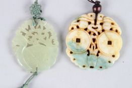 TWO EARLY 20TH CENTURY REPUBLIC PERIOD CARVED JADE PENDANTS. 2.5ins and 1.5ins diameter.