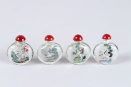 FOUR VARIOUS SNUFF BOTTLES AND STOPPERS.