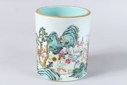 A GOOD FAMILLE ROSE BRUSH POT OF BOYS. 5.75ins high x 5ins diameter. Bearing QIANLONG MARK, POSSIBLY
