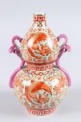 A CHINESE MULTI-COLOURED DOUBLE GOURD VASE decorated with wings and foliage. 9ins high.