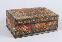 AN INDIAN KASHMIR PAINTED BOX. 9ins long x 5.5ins wide x 3.5ins high.