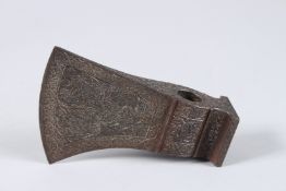 A PERSIAN METAL AXE HEAD decorated with animals and foliage. 5.5ins high.