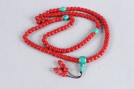 A RED AND GREEN BEAD NECKLACE. 36ins long.