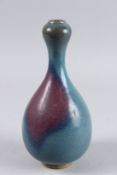 A CHINESE BLUE SPLASH GARLIC NECK VASE. 10ins high.