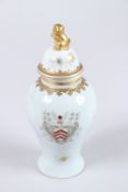 A GOOD SMALL ARMORIAL PORCELAIN TEA CADDY AND COVER.