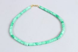 A GREEN BEAD CHAIN.